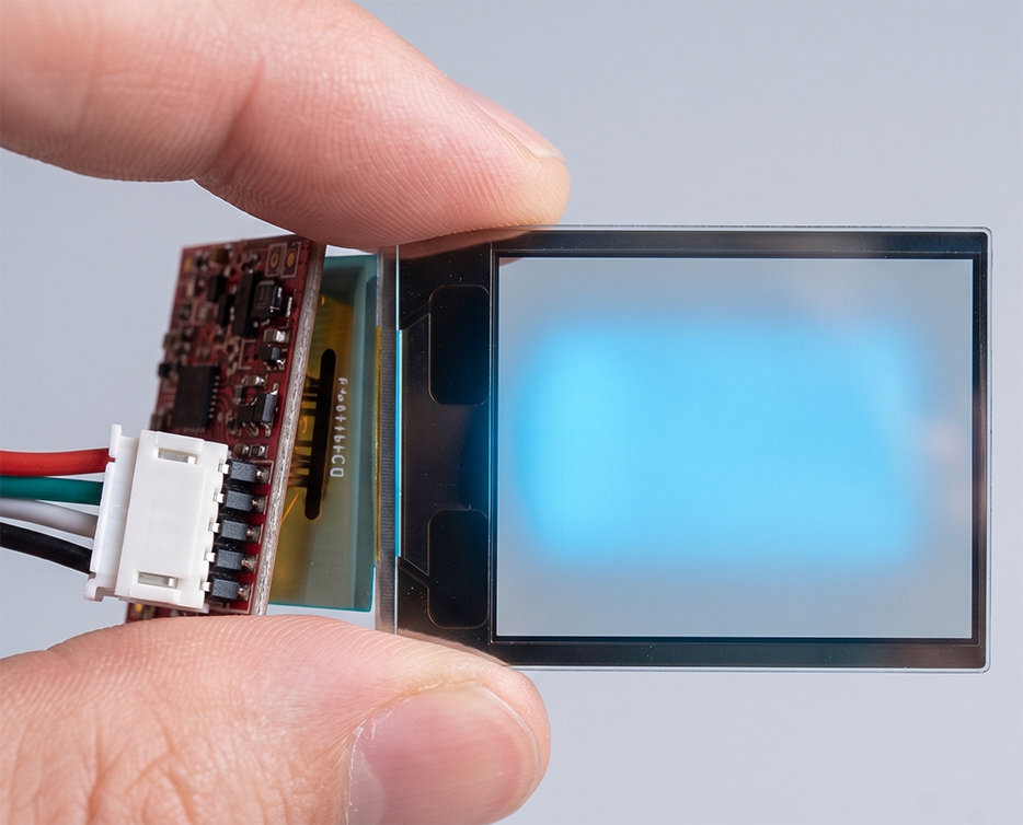 Small transmissive LCD projector panel held between two fingers